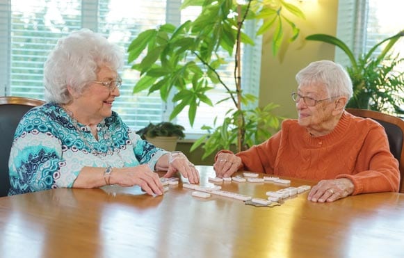 happy ladies playing dominos